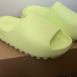 Glow green yeezy slides